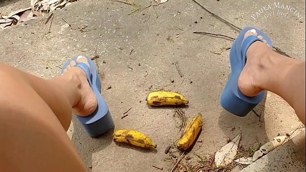 Crushing fruit in big flipflops